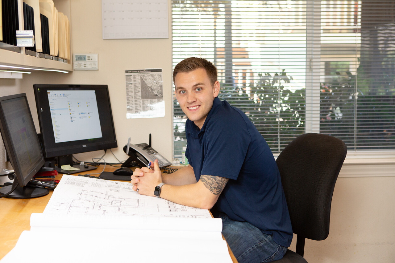 Collin Gannon – Project Manager at his Desk - Gannon Construction Company